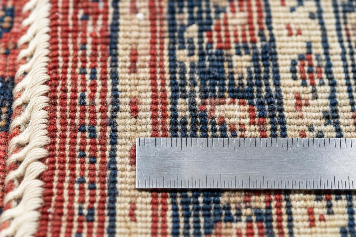 Ruler on the back of a hand-knotted rug to count knots per inch