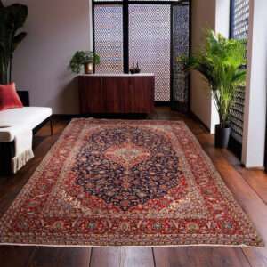 A handmade refurbished Persian Mashad rug, predominantly red, measuring 406cm x 240cm, featuring intricate designs that showcase its vibrant colours and craftsmanship.