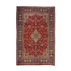 Persian-style red rug with a central medallion and ornate cream and blue border.