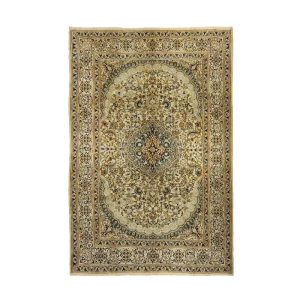 Ornate Persian-style rug with beige, navy, and gold patterns and a central medallion.