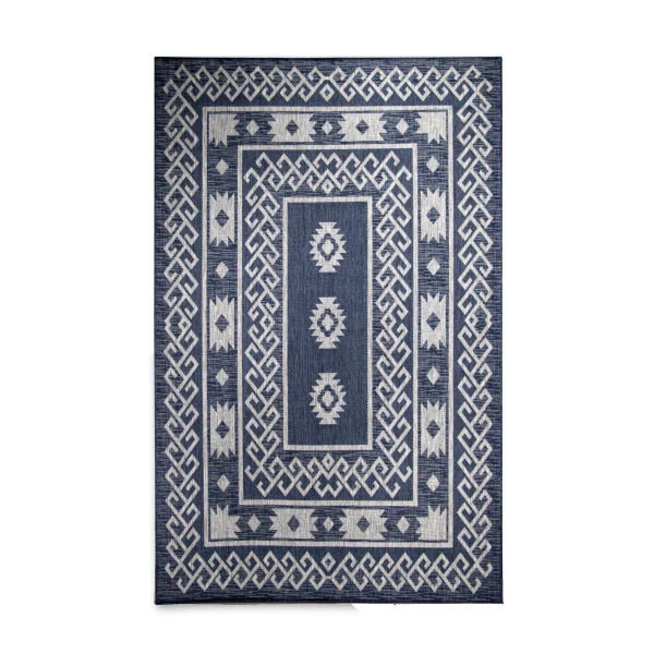 Blue woven rug with a double geometric border in white and a central diamond motif areaing a lighter blue field workwear-like texture.